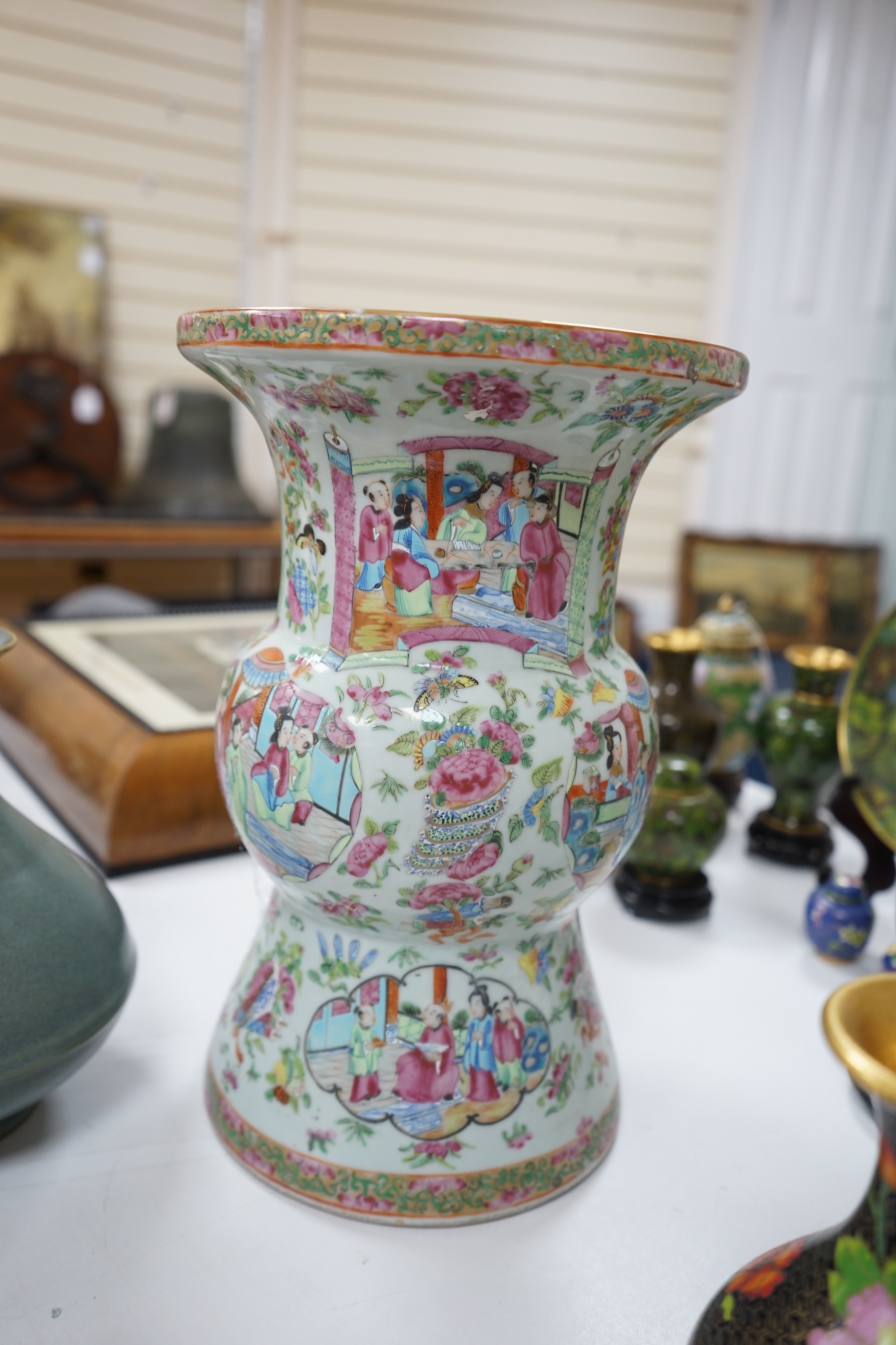 A large 19th century Chinese famille rose vase, a green glazed pear-shaped vase, and a blue and white dragon flask (3). Condition - poor to fair.